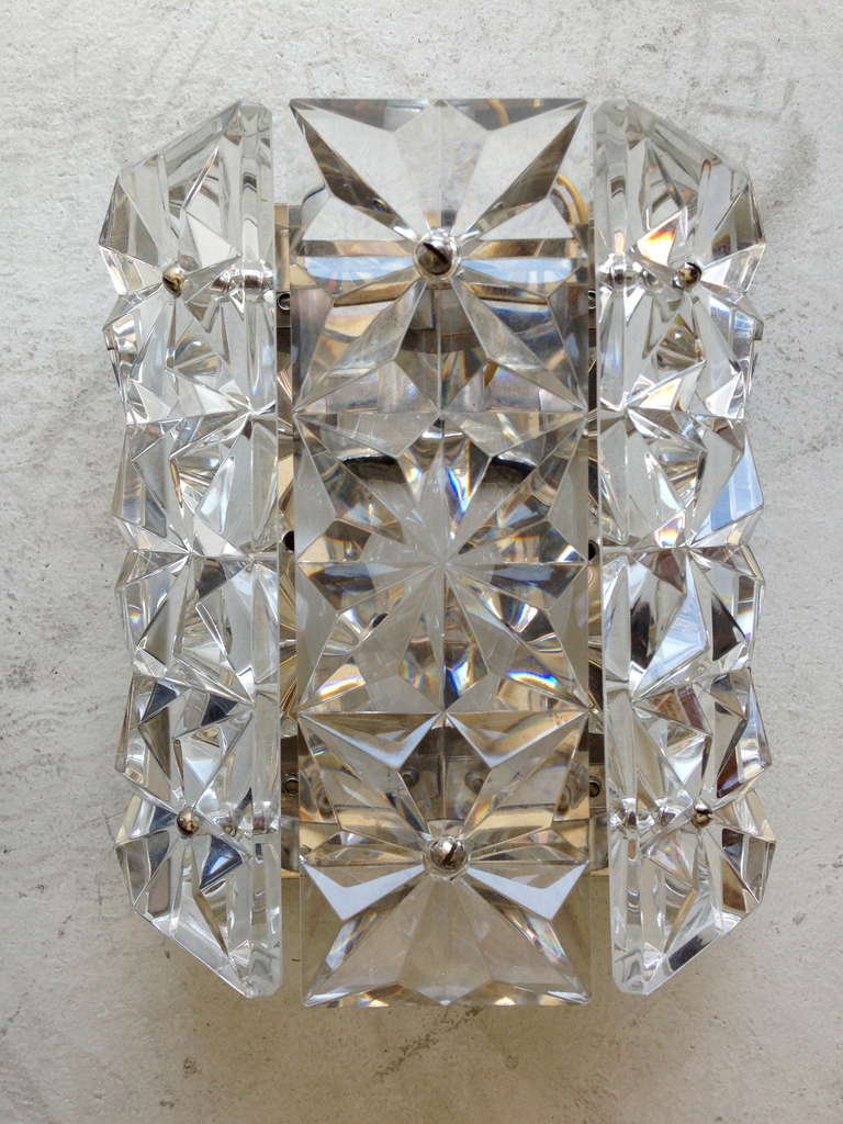 A wonderful pair of heavy Austrian crystal wall lights with chrome fitting and fixtures by Kinkeldey. Rewired