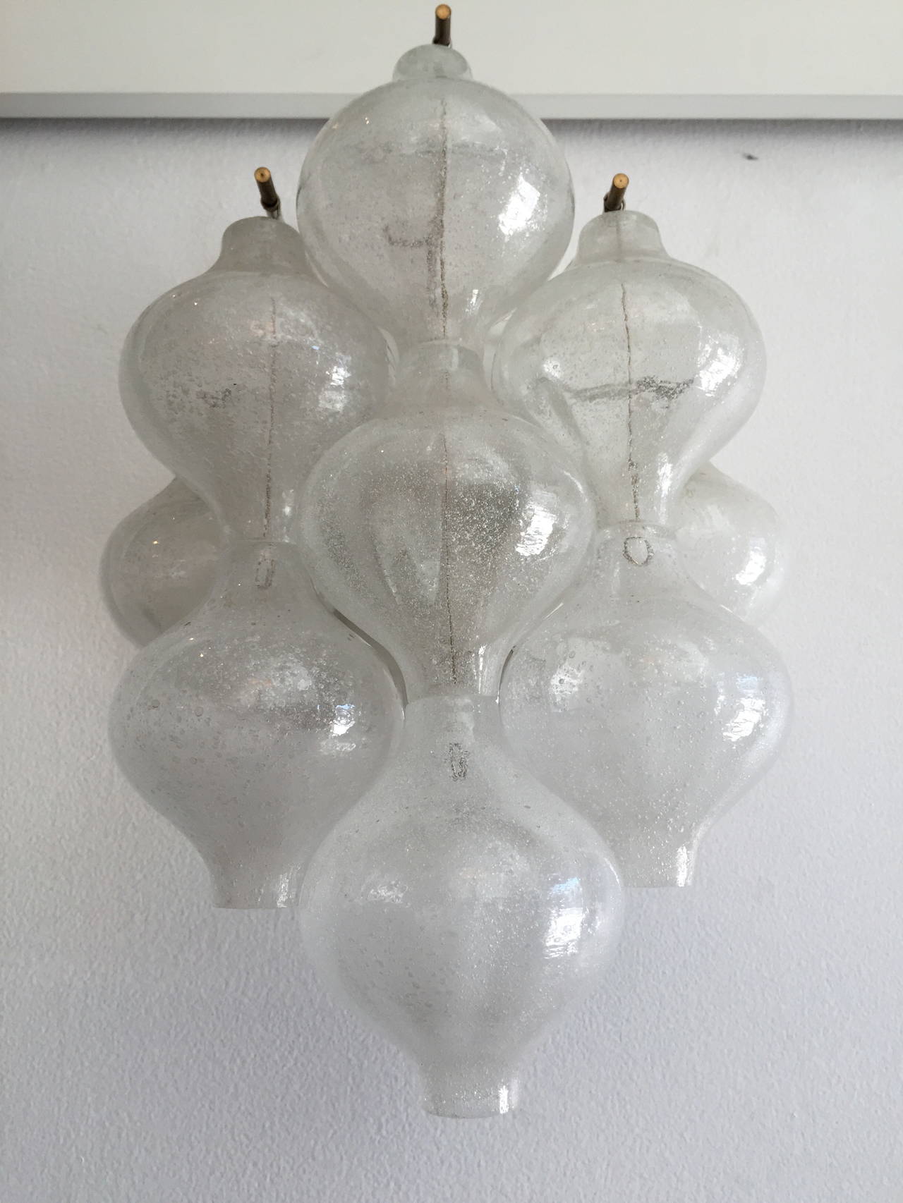 A great pair of 1950s blown glass ball and white enamel framed wall lights by JT Kalmar. Two-light sources each.