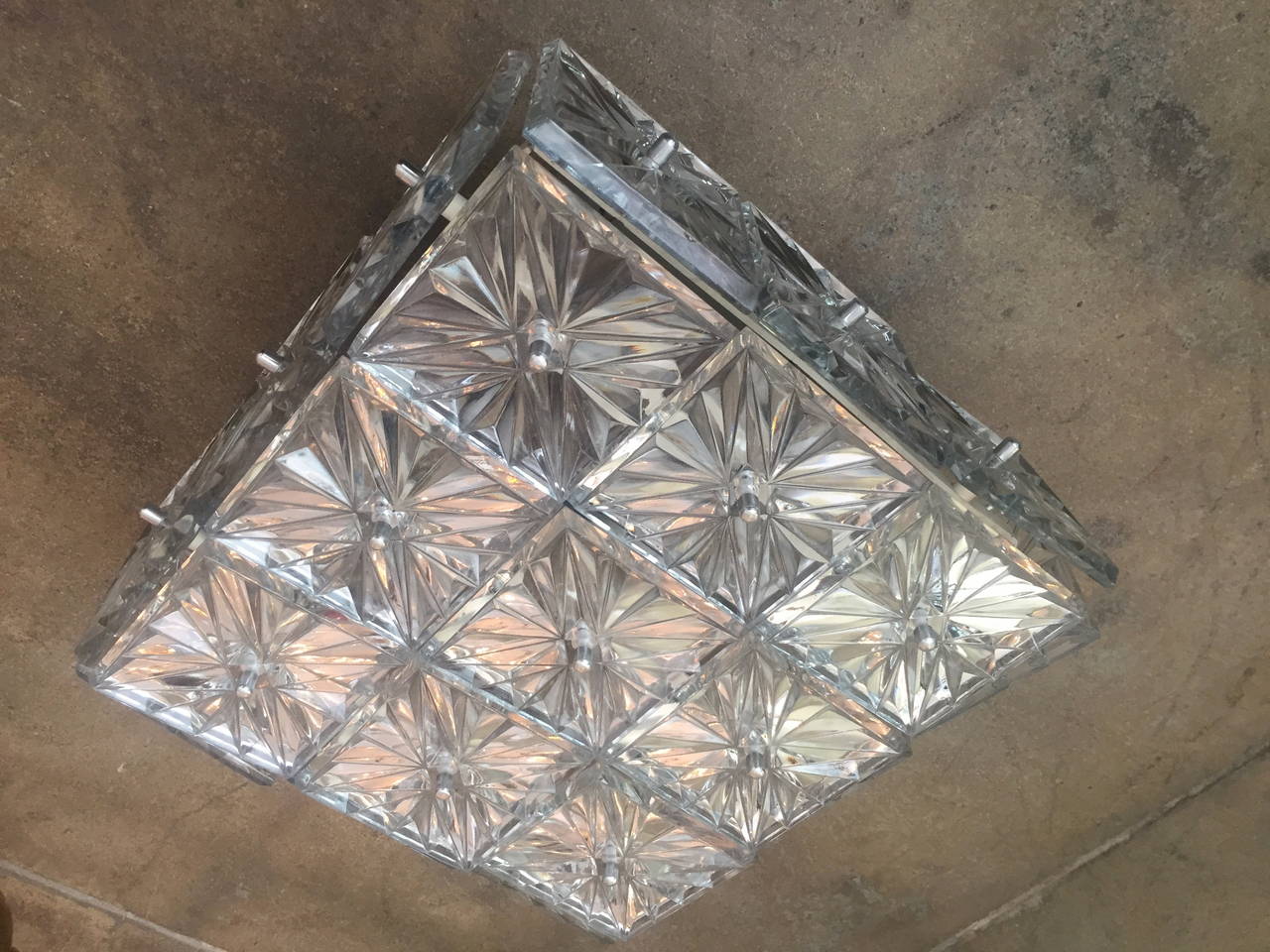 A great square 1960s Austrian crystal flush ceiling light by the maker, Kinkeldey. Rewired. Four-light sources, medium base bulb. Three available. 240 watts, total.