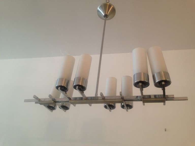 A sleek 1960s French chrome chandelier with eight frosted glass tube shades. Rewired.