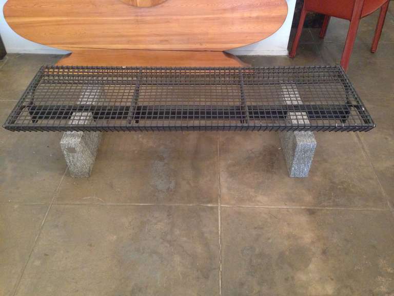 An original Osvaldo Borsani for Tecno bench or coffee table , designed for the Italian Malpensa airport in 1982.  The table is composed of a black enamel steel grid top on rectangular polished granite blocks. Original label. A rectangular glass top