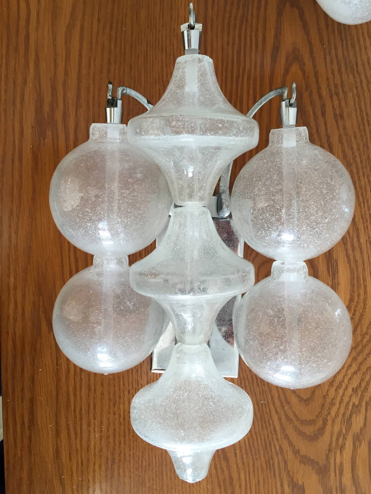 A great set of 1960s blown glass wall lights by the famed firm, JT Kalmar. Rewired. One-light source.