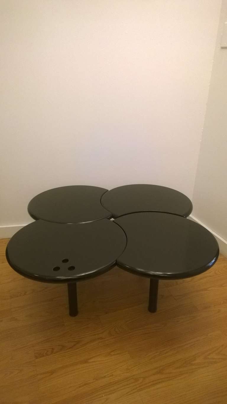 A French 1980s modern low table by the famed design firm, Airborne. The table surface can be adjusted by moving out the legs.