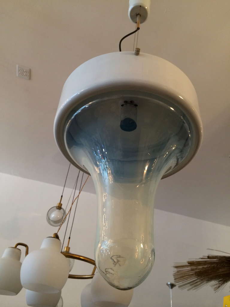 A wonderful handblown Murano glass pendant or flush light by Carlo Nason for Mazzega. The blue or green glass shade is in the form of a water drop and is attached to a white enamel fixture. Rewired.