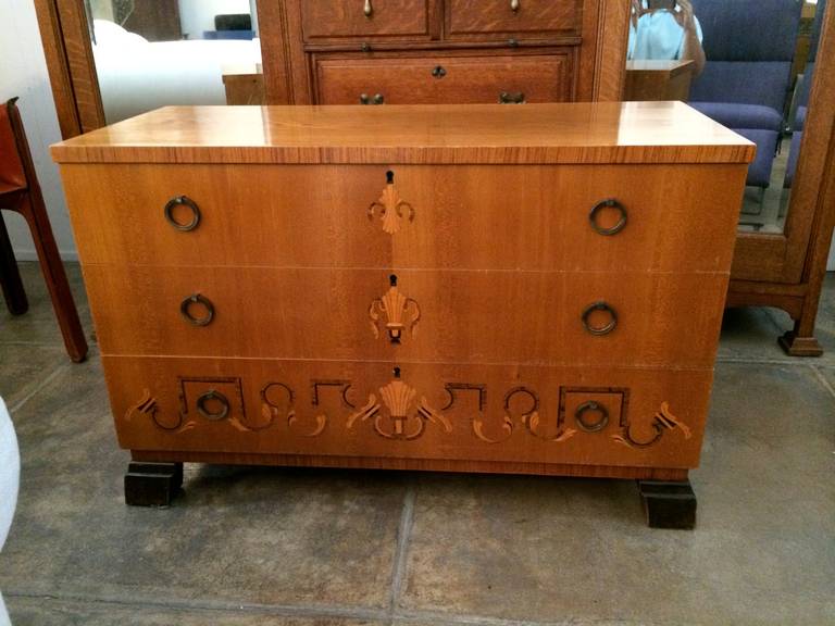 A Swedish Grace, three-drawer chest with a wonderful inlaid marquetry design and aged brass ring pulls.