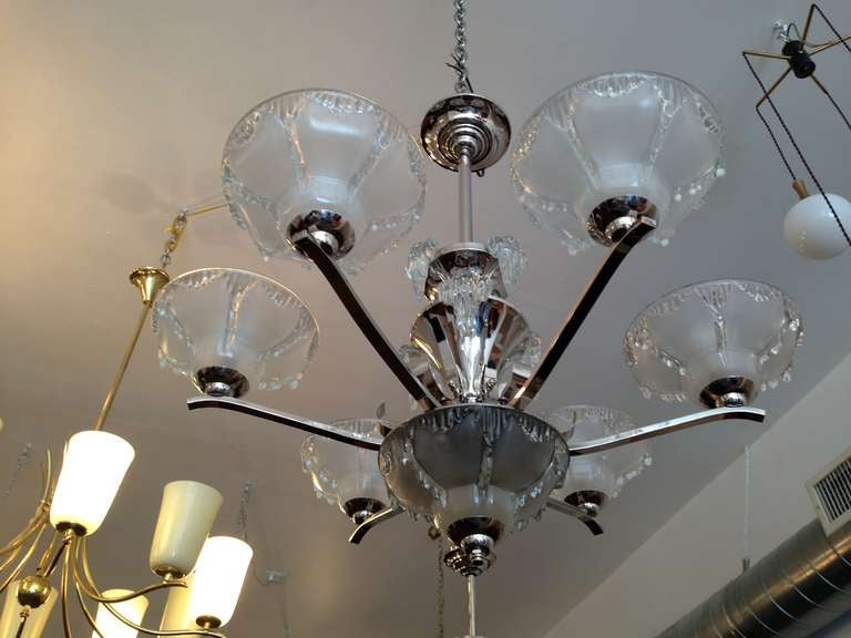 An original French Art Deco six-light polished nickel fixture with frosted and clear glass shades with multiple clear glass dripping ice elements. Rewired.