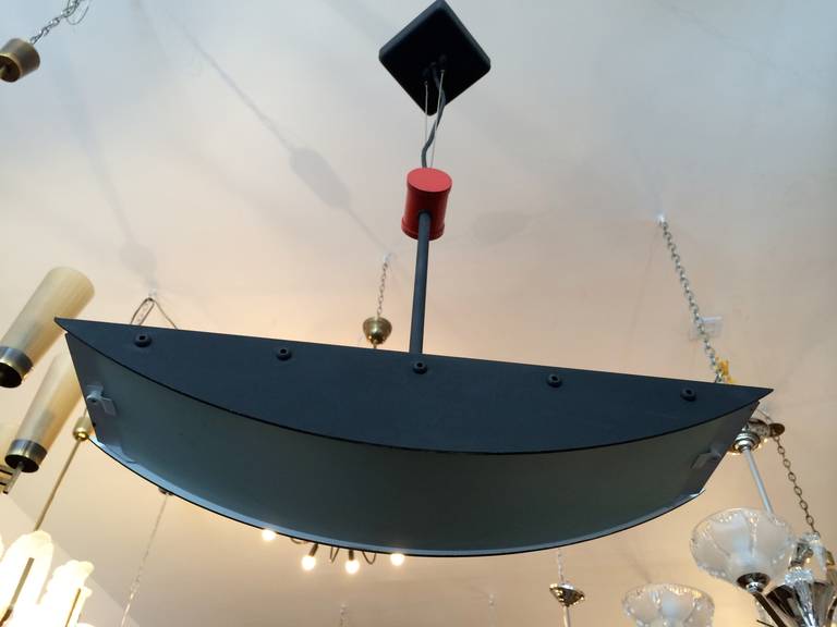 A New York 1980s "Art-tech" ceiling light by famed lighting designer, Robert Sonneman. Original label. Rewired.

Bio:
 Robert launched his own lighting company under the Sonneman brand in 1967. His products were featured in retailers