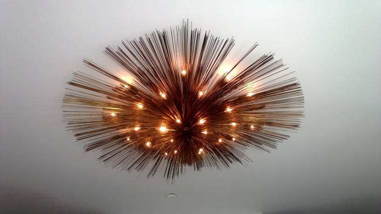 An extra large version of the C. Jere "nest" chandelier composed of four tiers and 24 lights. Rewired. Signed.