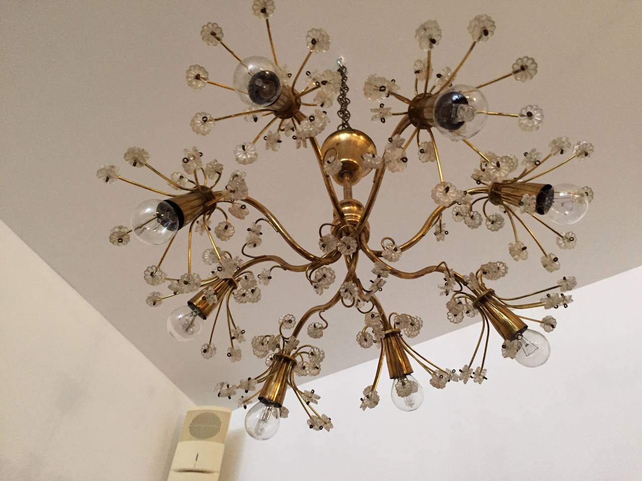 A wonderful 1960s Austrian crystal Mid-Century golden aged polished brass and glass chandelier. Designed by Emil Stejnar for Rupert Nikoll. Rewired. Eight-light sources. The ceiling pole can be lengthened or the body place on a chain.