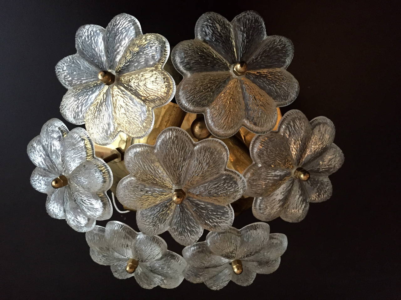 A great decorative pair of 1950s Austria polished brass fixtures with flower glass elements. Rewired. Can be used as flush ceiling lights or wall sconces. Three light sources each.