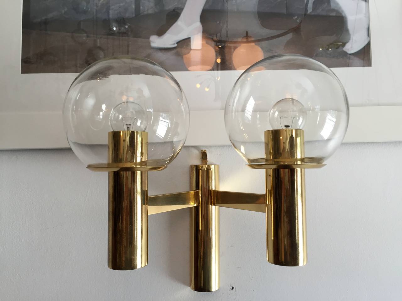 A pair of 1960s Swedish brass and glass globe sconces by Hans Agne Jakobsson. Rewired.
