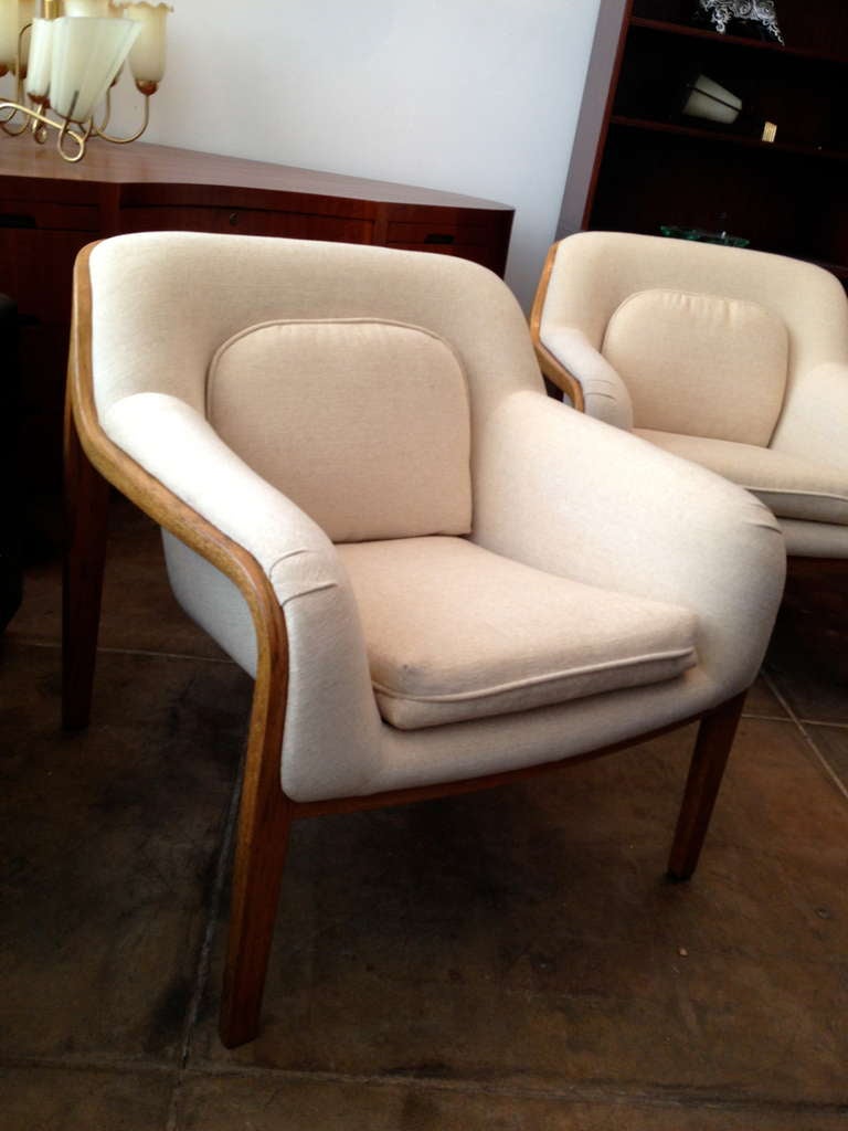 An original pair of upholstered  bent walnut lounge chairs designed by Bill Stephens for Knoll.