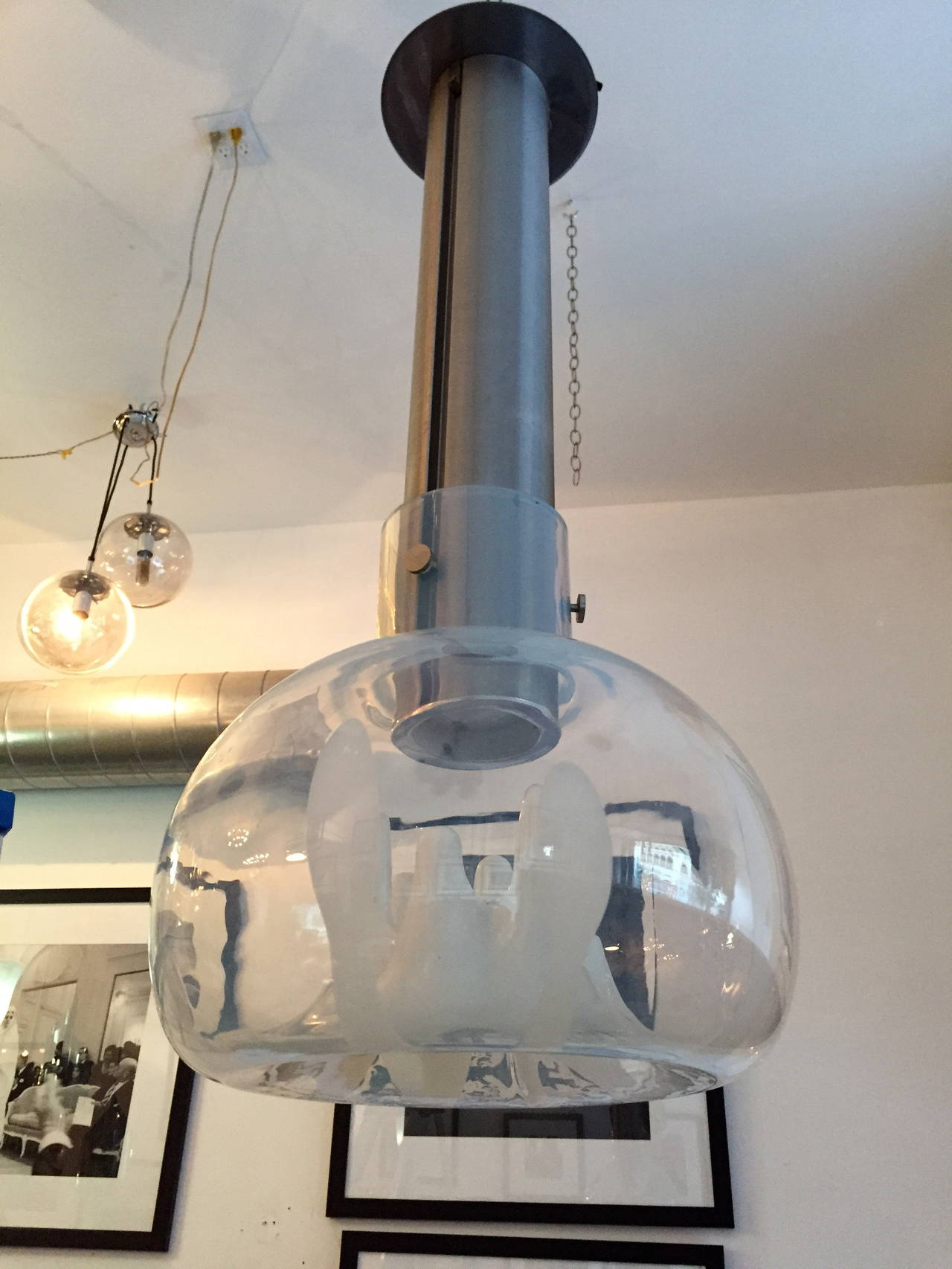 A great 1970s Space Age Murano blown glass shade with a brushed steel Industrial fixture. Rewired.