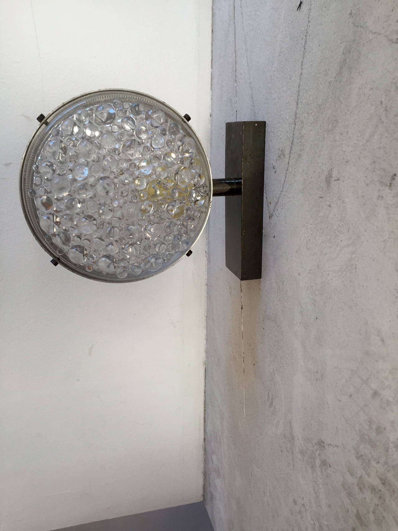 A great pair of 1960s Space Age Italian sconces composed of a chrome fixture and textured bubbled glass shades. Rewired.