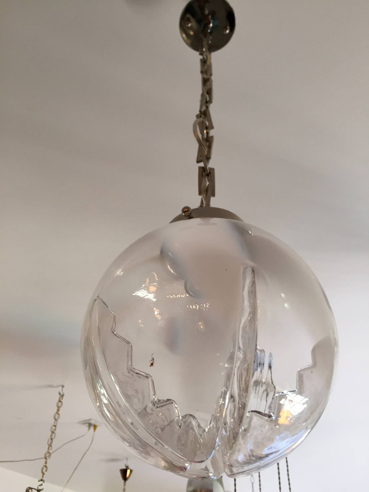 A pair of blown Murano glass pendants with polished nickel fittings and chain. Rewired.