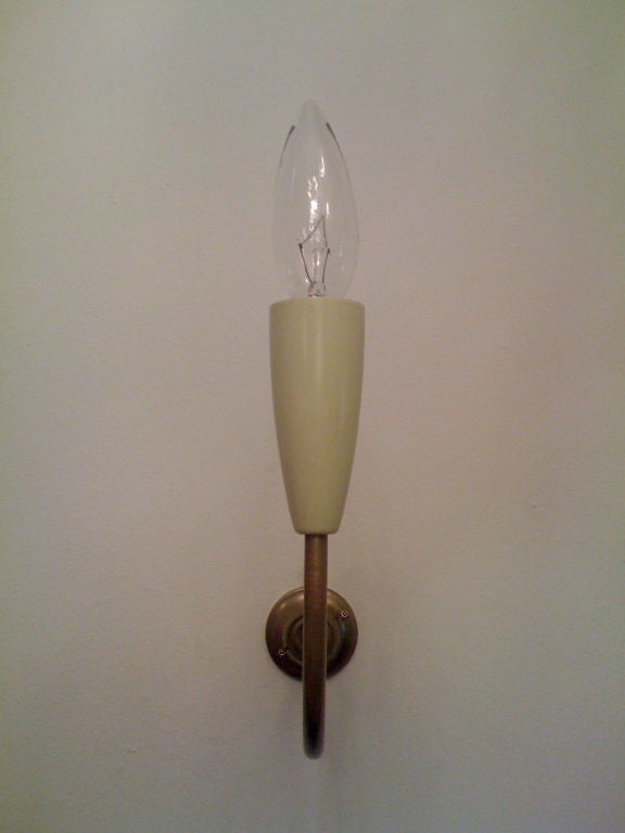 A great decorative scrolling brass and white enameled Italian wall lights/Sconces.