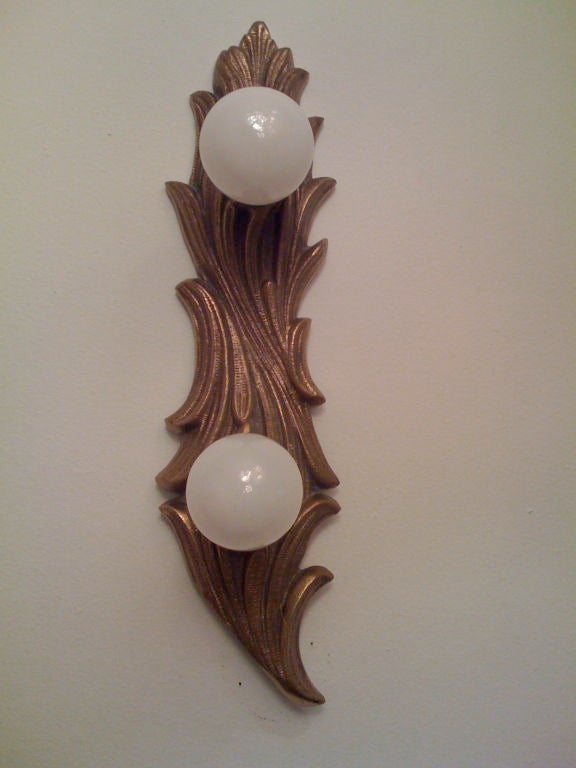 A pair of decorative darkened brass sconces by Lightolier. Two light sources each.
