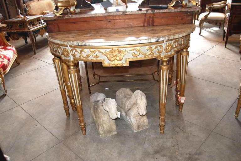 Painted, gilded and carved Italian demilune console.