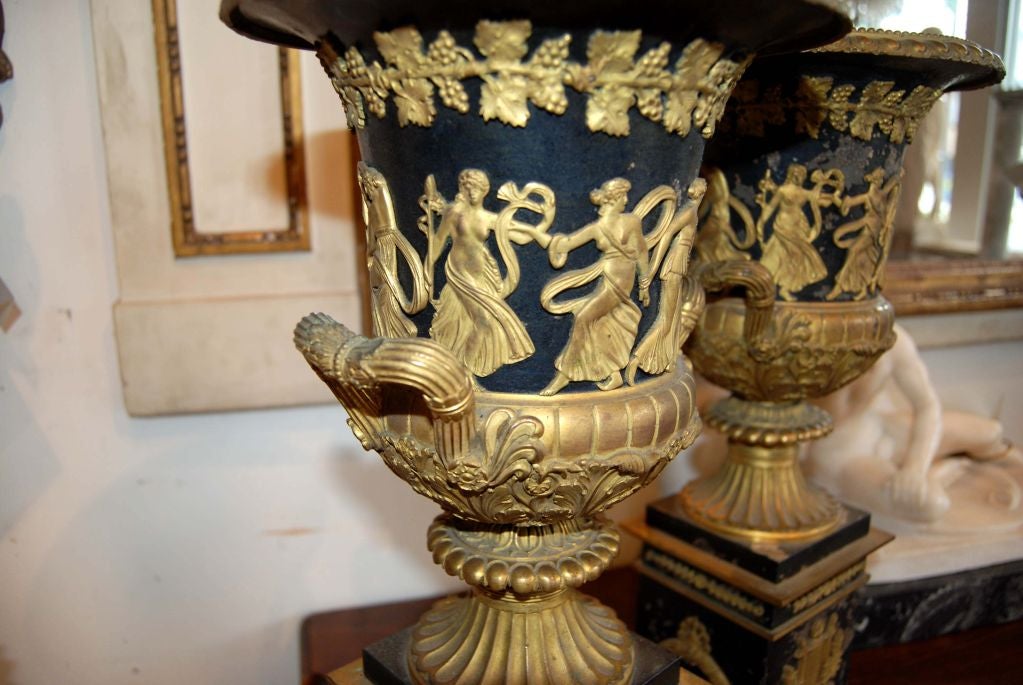 Beautifully decorated Empire bronze urns.