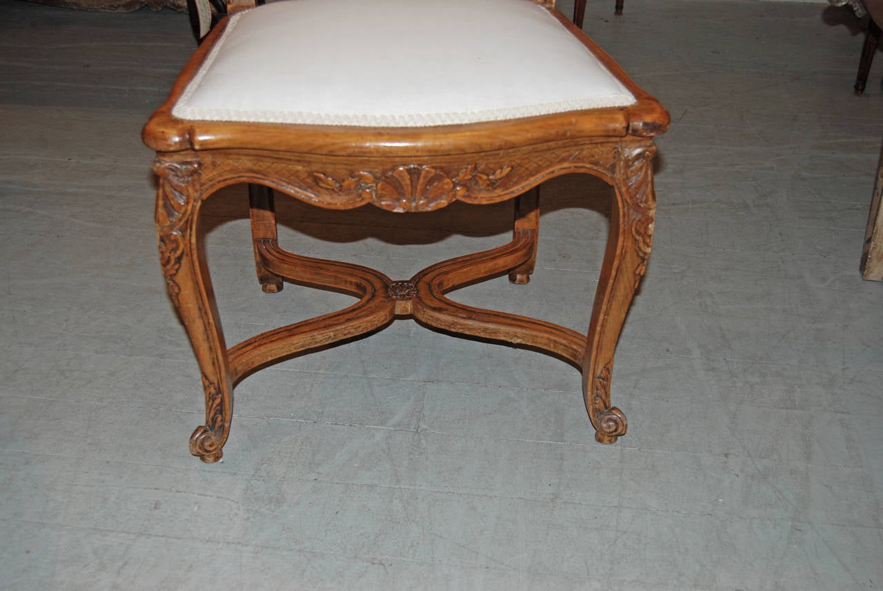 Beautifully carved set of eight walnut dining chairs.