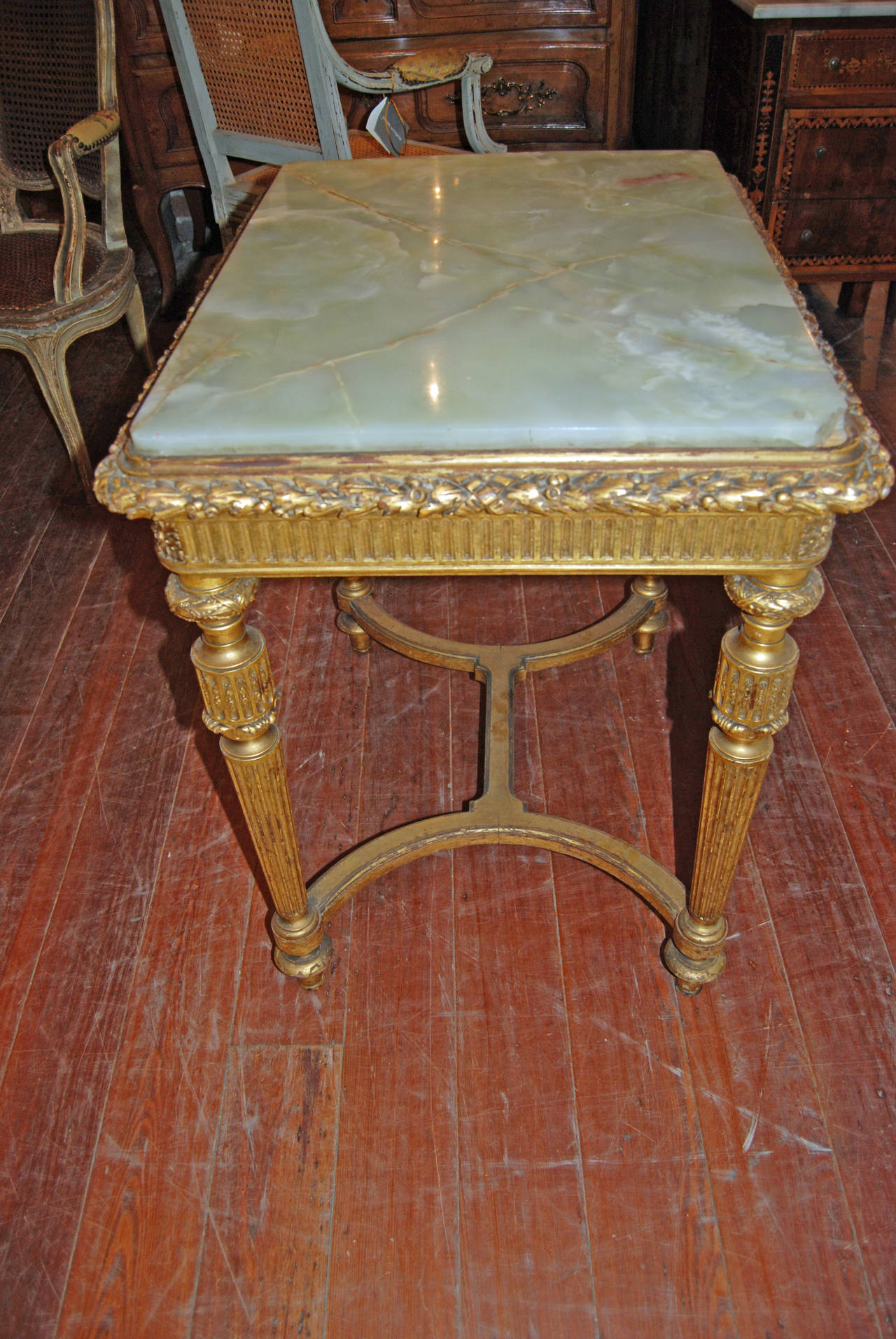 Beautifully carved and gilded French center table with green onyx.