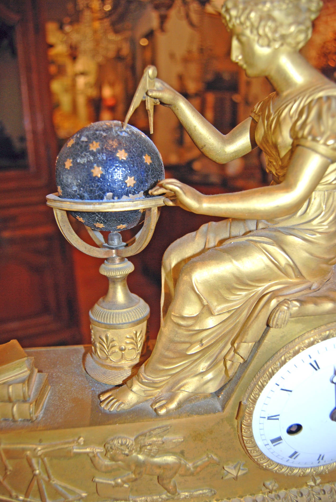 Beautifully chased bronze doré clock depicting the Goddess Urania with the symbols of Astronomy.