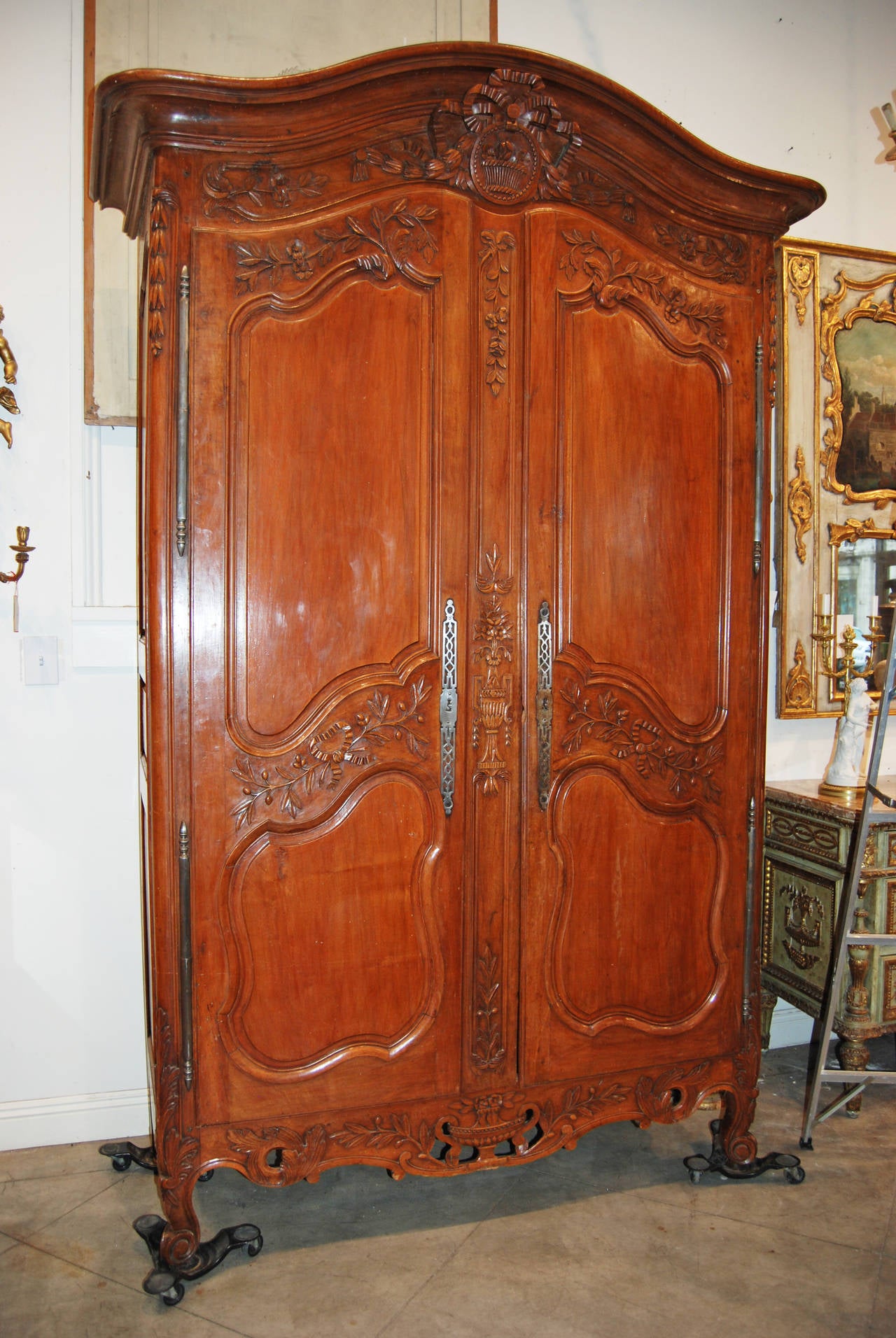 Beautifully carved walnut armoire from the Normandy region of France.