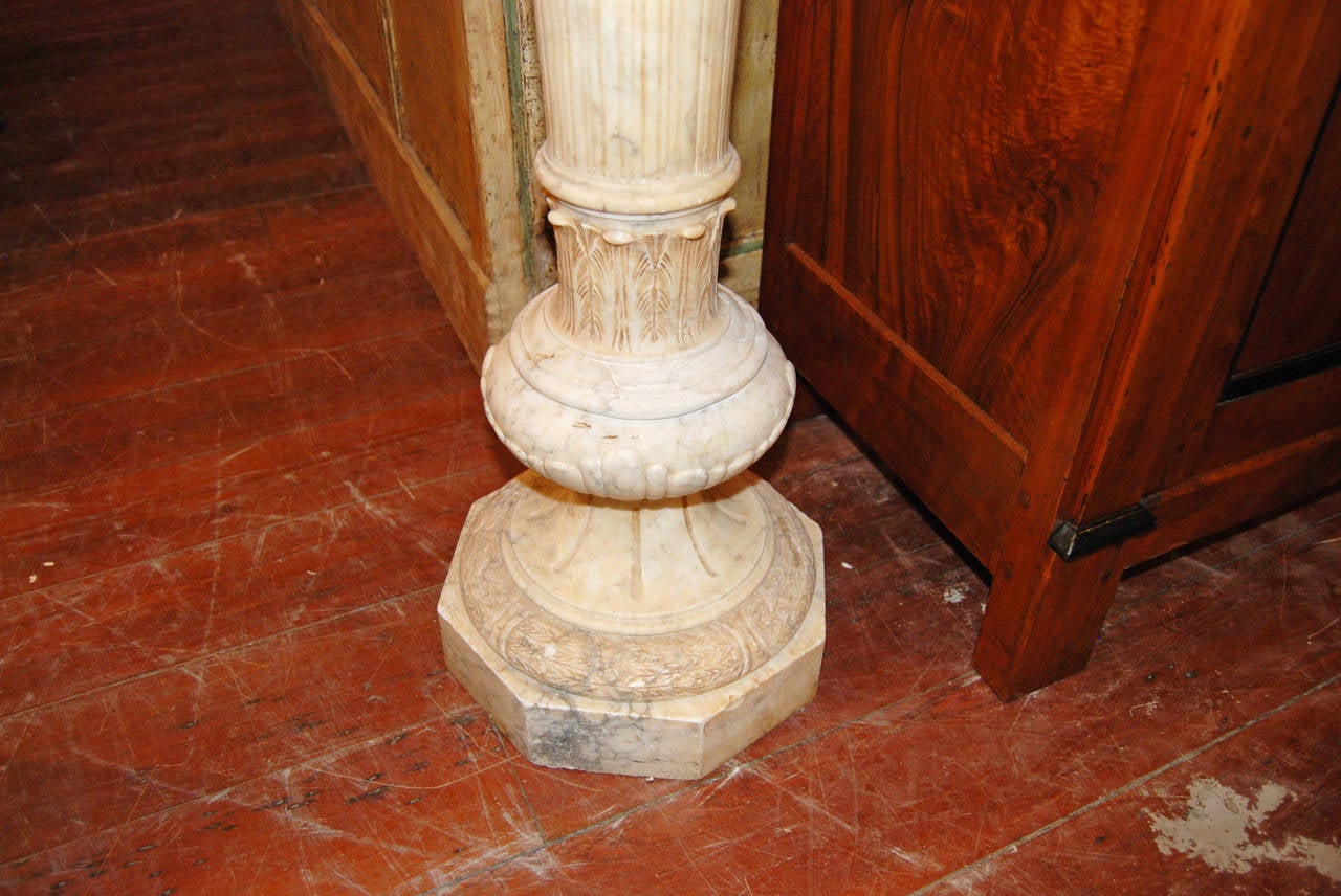 Beautifully carved alabaster urn with pedestal.