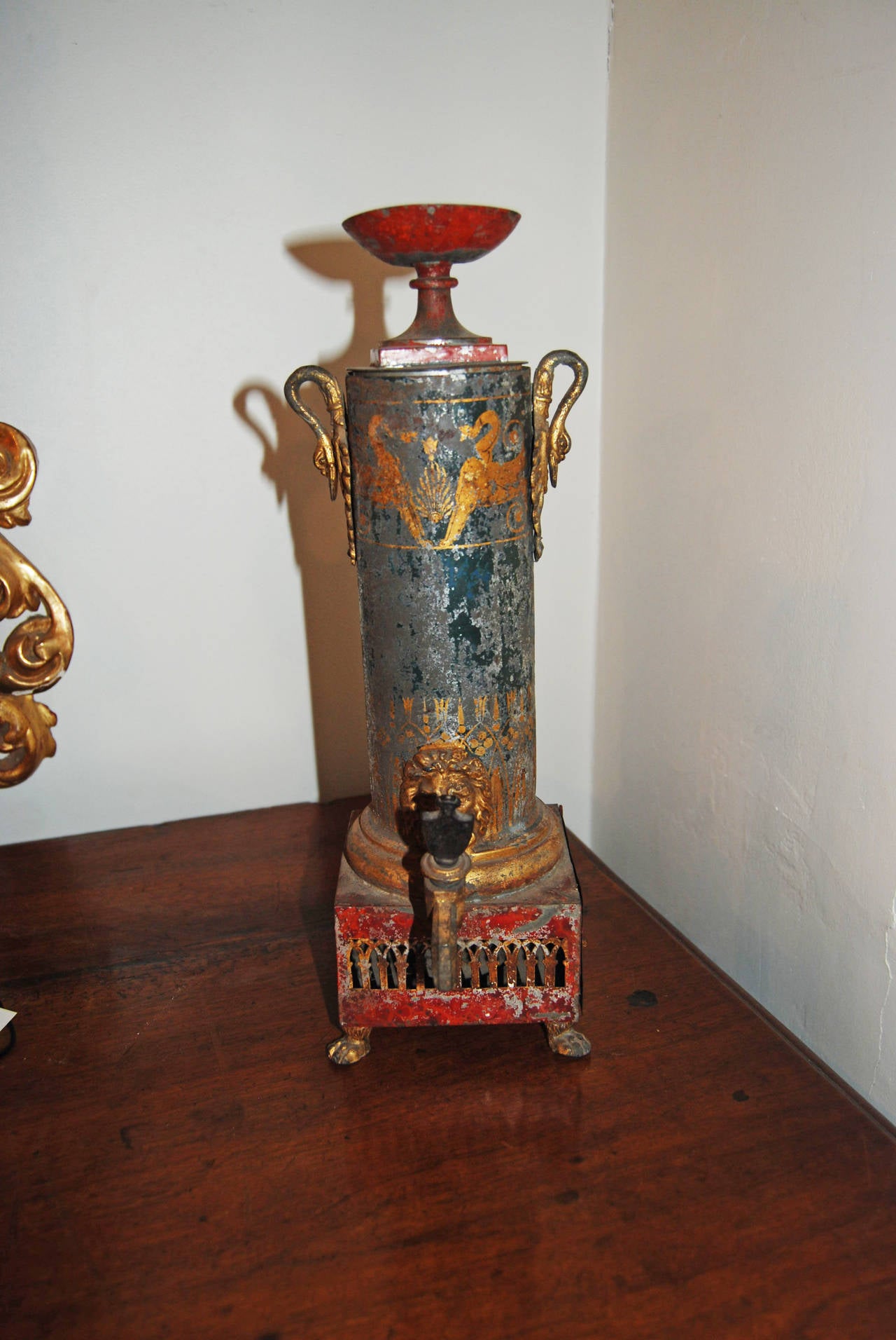 Painted and gilded tole water heater.