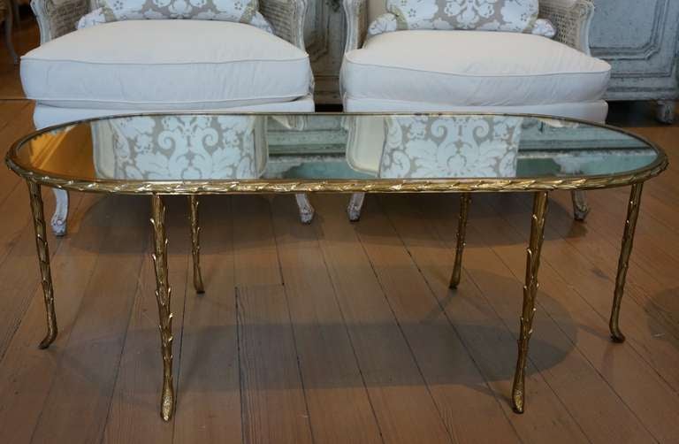 Beautiful 1950s Maison Baguès gilt coffee table with antiqued mirrored glass top.