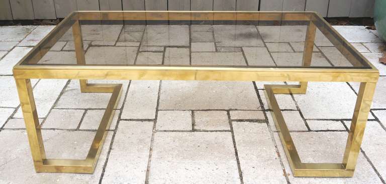 1960s brass coffee table with smoked glass by Guy Lefevre.