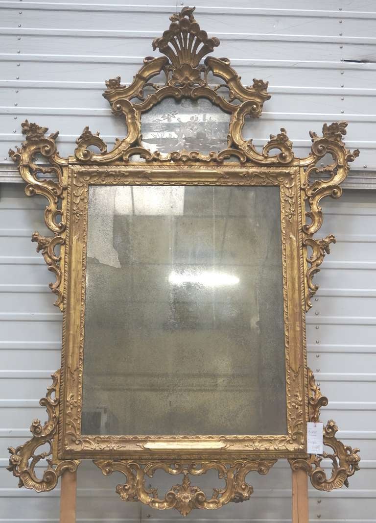 Venetian 19th century giltwood mirror. Original mirror.
Mercury glass dimensions: H = 33.5
