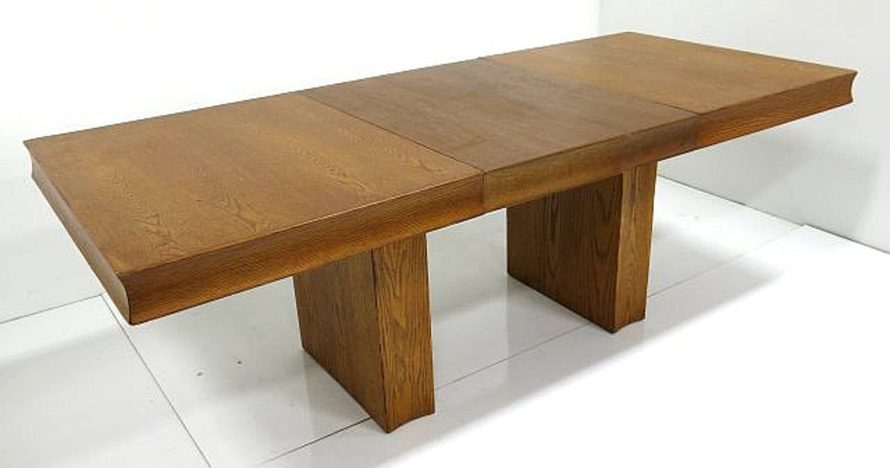 Clean, simple and striking! This French oak modernist dining table makes a very strong statement in any room. Purchased from a Park Avenue Estate.
Retains original finish but can have re-done for a fee.

Measurements without leaf 29.5 in H x 38