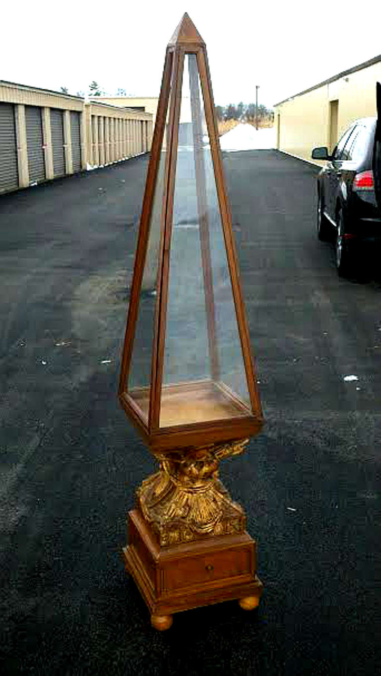 A hand carved and gilded fruit wood vitrine. Italian circa 1930's.  In wonderful condition and of superb quality.