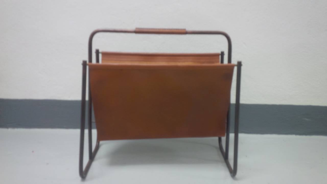 Cognac leather and steel magazine holder by Jacques Adnet. France, circa 1940.