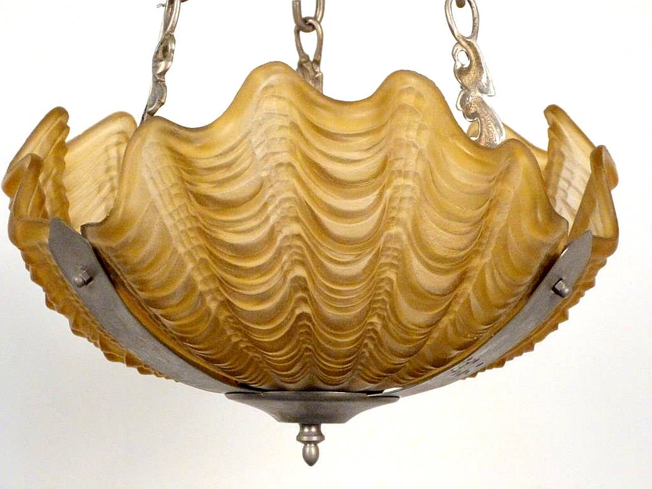 Great form and size.  Pressed amber glass giant clam shells along with Chromed chains.
Perfect for the beach house.