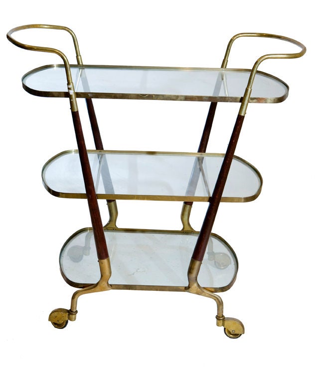 Exceptional wheeled bar cart with mahogany and bronze frame inset with glass.  In the style of Ico Parisi.  Italy, circa 1930.