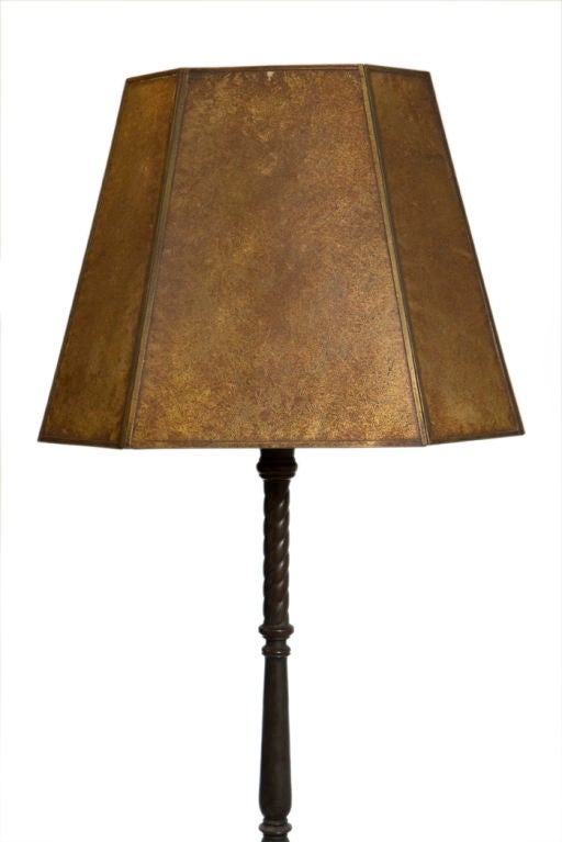 Bronze candlestick lamp by Oscar Bach with rare lions head design on base and period mica shade. USA, circa 1930.<br />
<br />
Signed with metal label, 