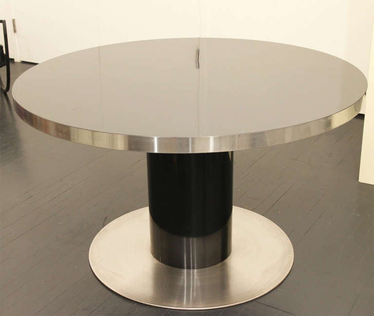 Beautiful Aluminum base and black lacquer top table.
Exceptionally rare,this item is in amazing condition. It is very rare to find pieces of his available in the United States. 

