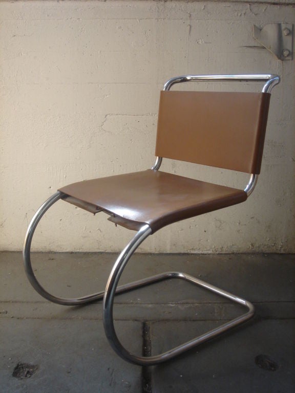 Original vintage MR dining chair by Mies van der Rohe for Knoll International. Eight (8) chairs available; priced individually.

Made in Italy, circa 1970. A polished chrome frame with Cognac leather seats; some chairs retain original label (or