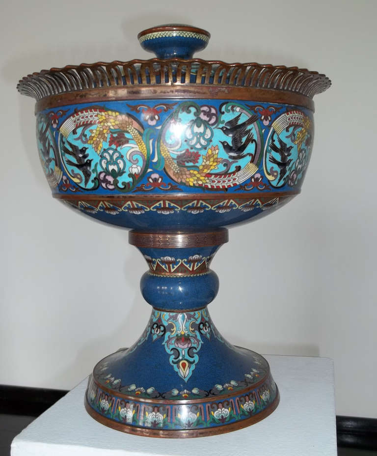 A large1 9th century cloisonne footed bowl with lid and bronze trim. It is beautifully decorated with multi-colored, flowers and birds all against a gilt wire inlay diaper on a dark turquoise ground.
Amazing detail and in immaculate condition. No