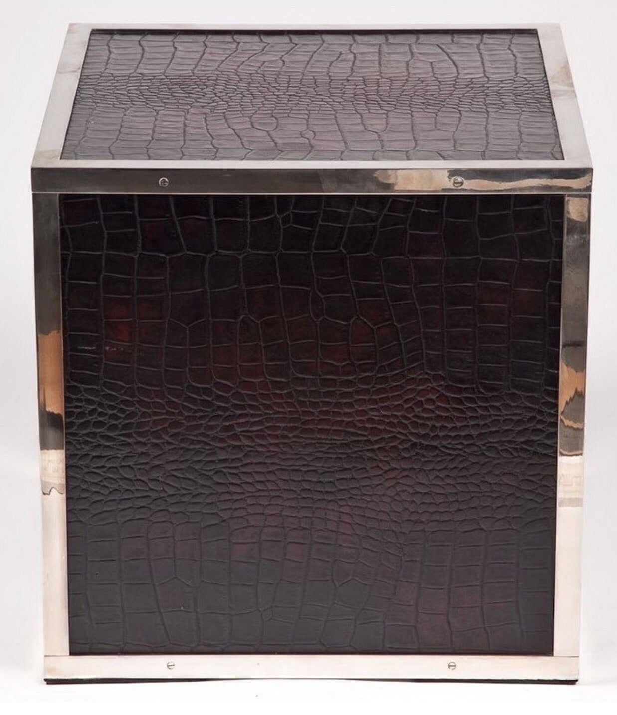 A versatile, Ralph Lauren style cube table covered in faux brown crocodileskin with chrome trim.  USA, circa 1990.  Ideal as an end table or visual display pedestal.