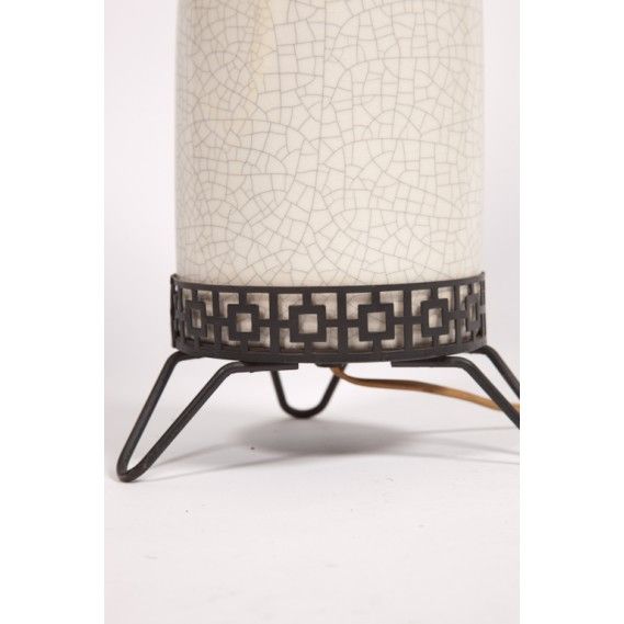 Table lamp with a white ceramoic crackle glaze finish on a black metal stand.  USA, circa 1960.  Includes custom white lampshade.

Dimensions:
21.5 inch height overall
19 inch height, to socket base