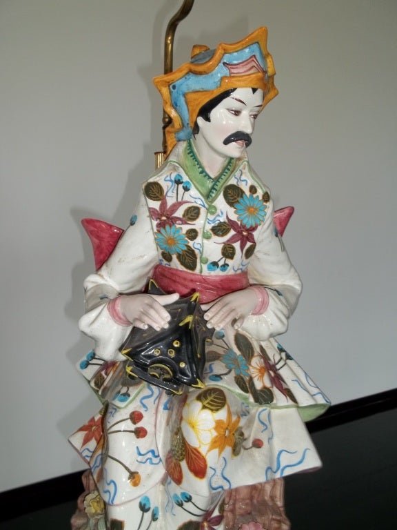 Hand-painted ceramic table lamp of Asian gentleman holding a garden lantern by noted ceramicist and artist Domenico Poloniato.  Signed on reverse.  Italy circa 1940.  Shade not included.

Dimensions:
Height (to top of socket): 39 inches
Height