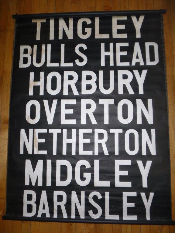 Vintage bus sign from London.  UK< circa 1950.

White text on black canvas with black wood towel hanging rods.  Includes the following stops: Tingley, Bulls Head, Horbury, Overton, Netherton, Midgley and Barnsley.