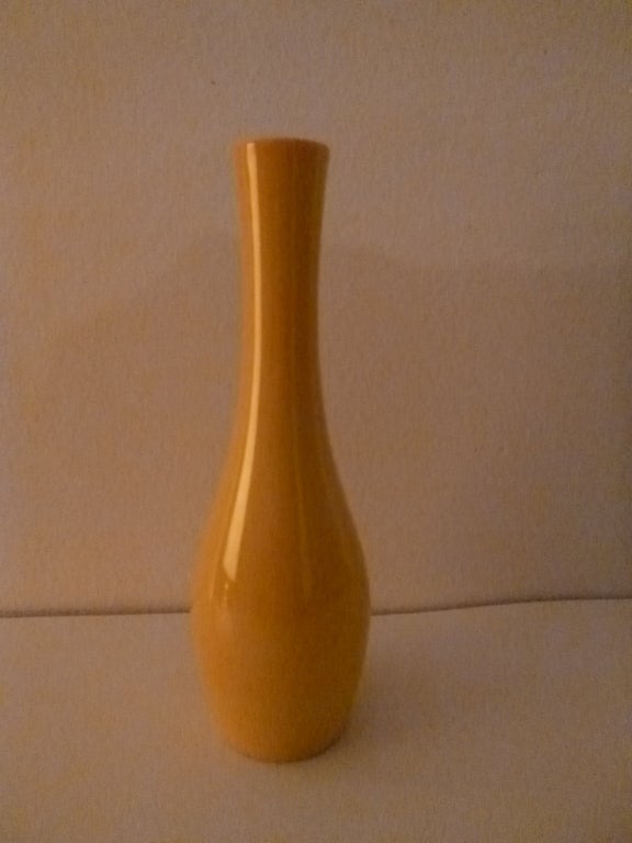 A pair of yellow vases. USA, circa 1970. 

The taller vase is signed, 