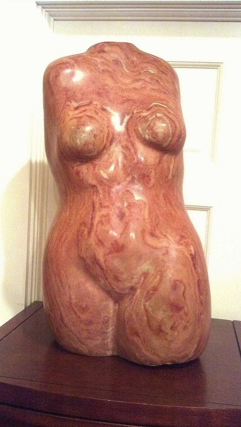 Well done and sensual are just a few words to best describe this sculpture. Hand carved from red onyx that only comes from Pakistan.  With a height of 24in. a width of 13in.and a depth of 11in. it makes a great statement. Purchased from an Estate in