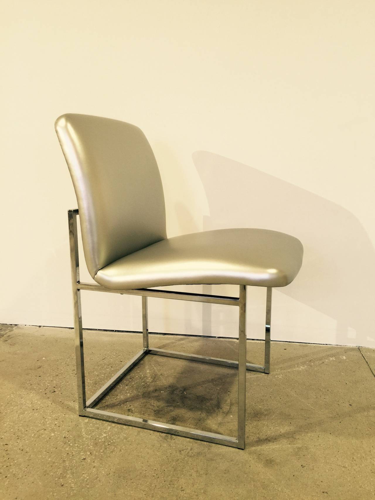 Set of up to 10 (ten) dining chairs with tubular frames in chrome finish by DIA (Design Institute of America) after Milo Baughman. USA, circa 1970.  Low back model.  Priced individually; may be purchased in quantities from one to 10 chairs.  Price