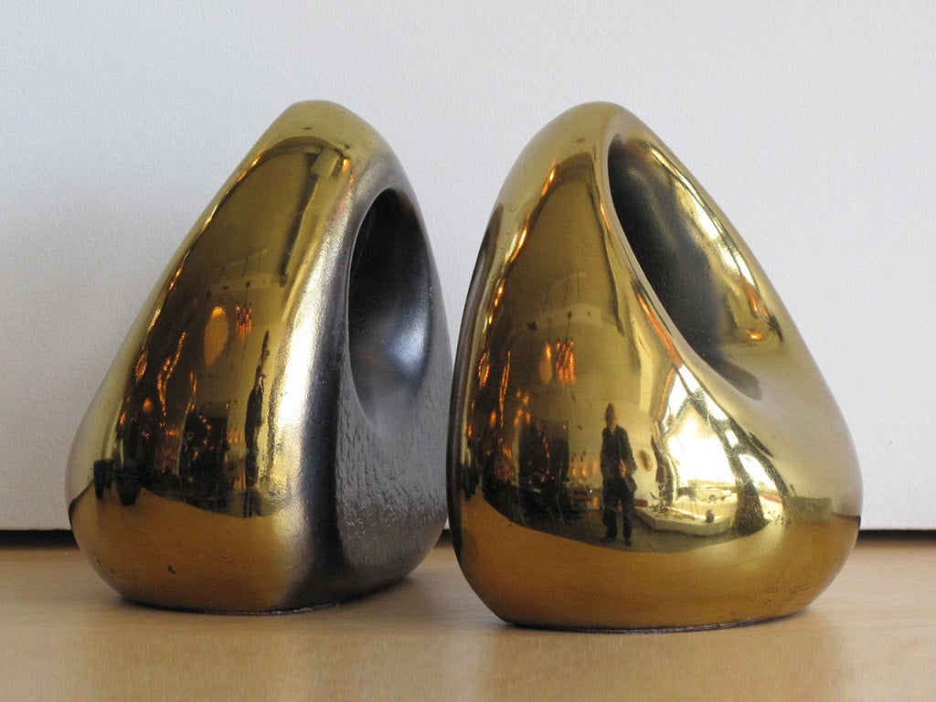 Sleek Pair of Ben Seibel for Jenfredware Brass Orb Bookends. Very nice original condition with a Wonderful Patina. Would Work Beautifully as Freestanding Sculptural Accessories.