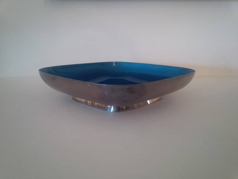A square-shaped silver footed bowl with a blue enameled interior. Sterling. Stamped 